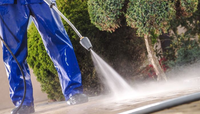 Men Washing Garden Residential Brick Paths with Professional Pressure Washer